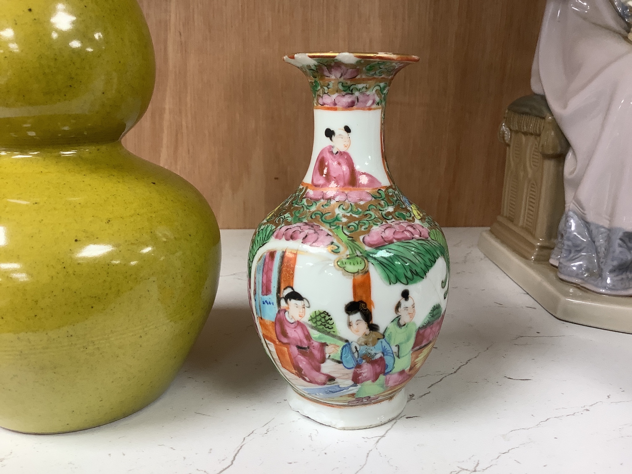 A Chinese yellow ground double gourd vase and a similar famille rose baluster vase, tallest 18cm